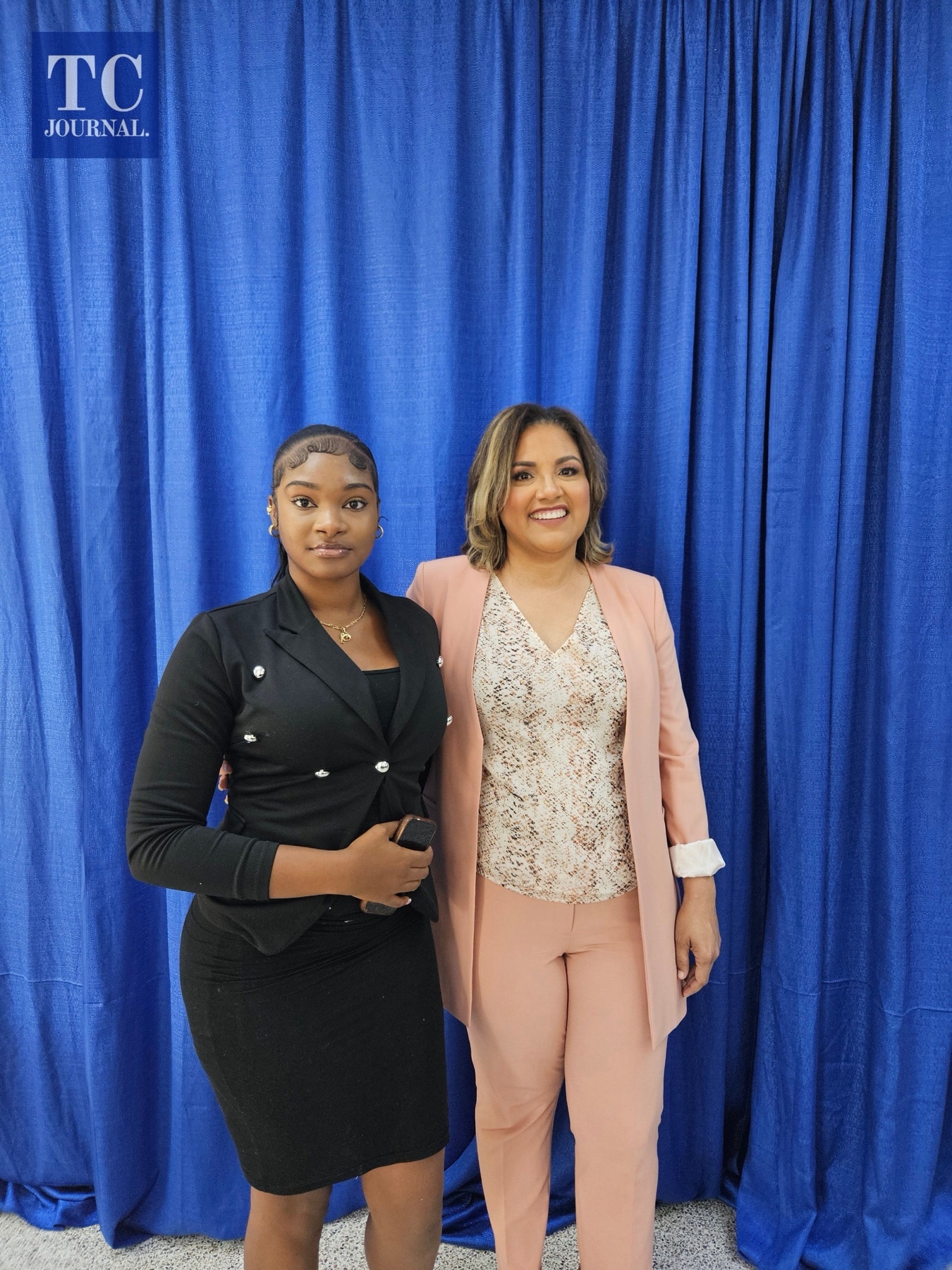 Miss Natalia Thompson, left, with a Foundation representative at a scholarship event.